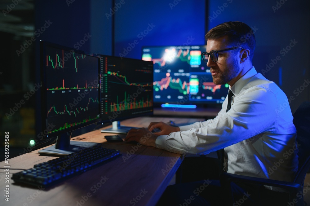 Crypto trader investor analyst looking at computer screen analyzing financial