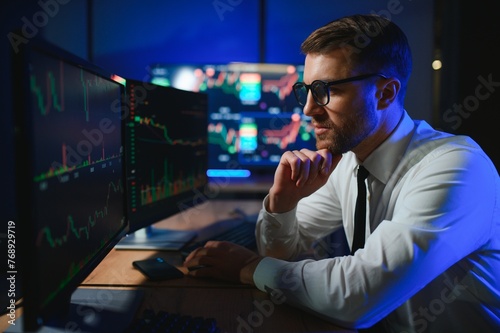 Financial Analysts and Day Traders Working on a Computers with Multi-Monitor