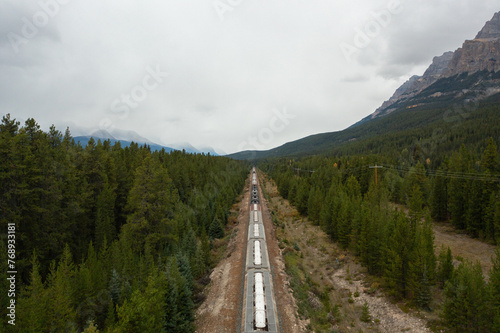 Train tracks crossing the rocky mountains of Canada