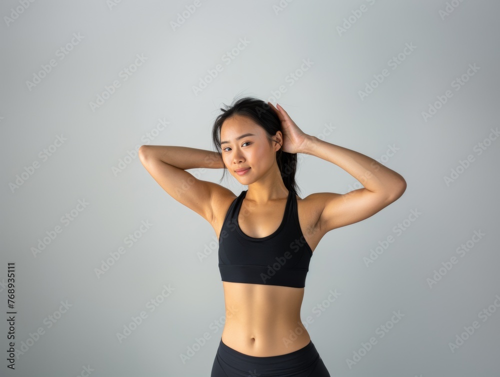 Attractive woman with a fashionable hairstyle in stylish sportswear. Fashion and beauty, active lifestyle and sports.