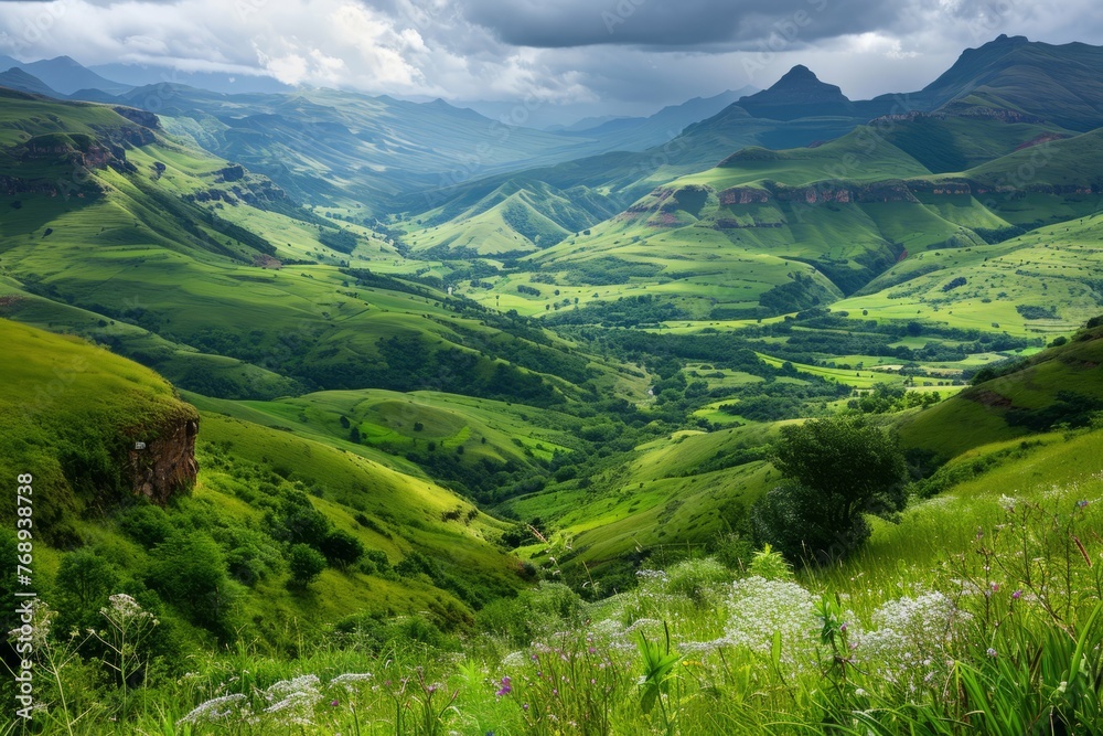 Obraz premium Breathtaking view of lush green valleys and rolling hills under a dynamic sky.
