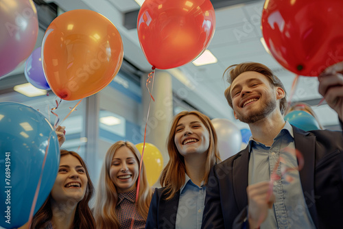 A collective of youthful, ambitious professionals with balloons, commemorating a milestone. A festive or formal gathering within an office space