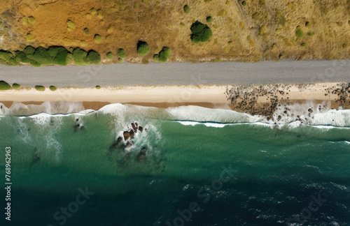 Aerial view of the road along the coast from the drone. Travel by car in summer time. The sea coast and the road.  photo