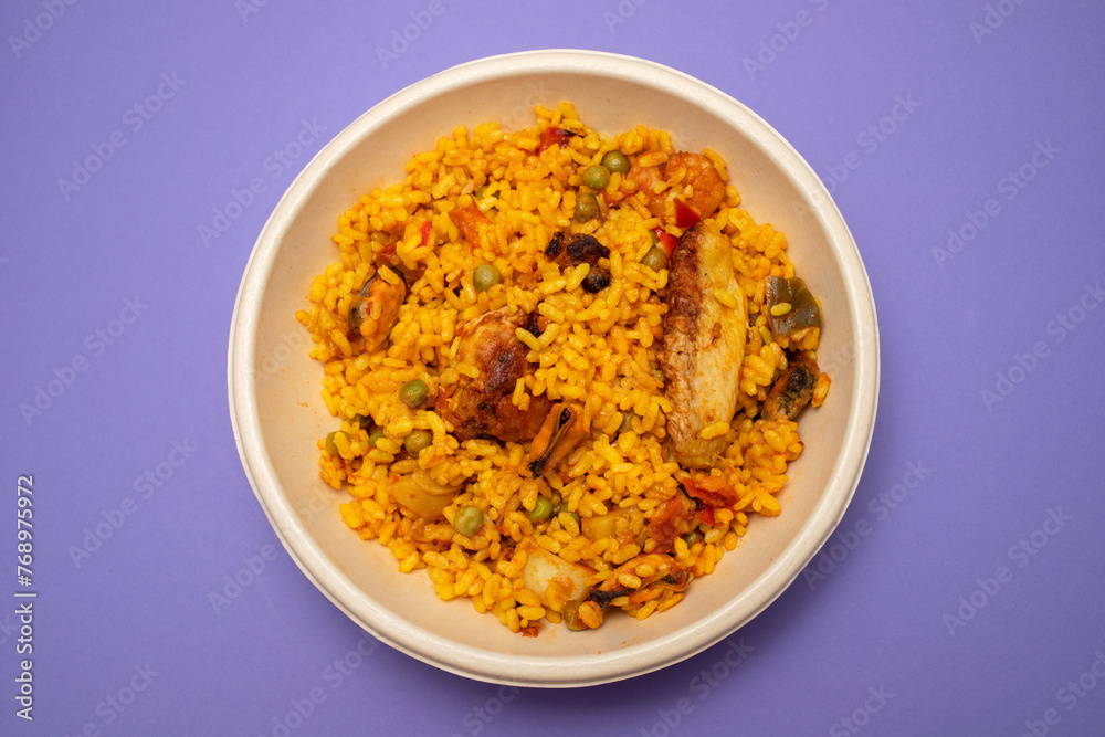 typicla spanish dish paella in plastic plate typicla spanish dish paella in plastic plate