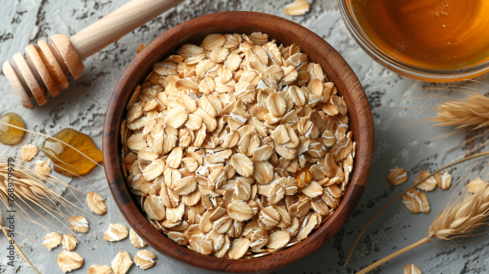 Fresh honey with oats in a wooden bowl top view Fresh honey with oats in a wooden bowl top view