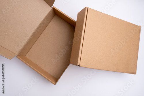 Brown paper box. Cardboard box isolated on white background. Place for text. Gift box
