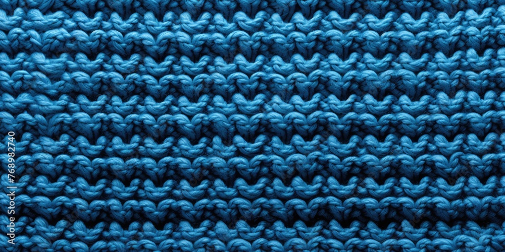 Texture of knitted fabric. Classic blue color. Theme of hobby and creativity