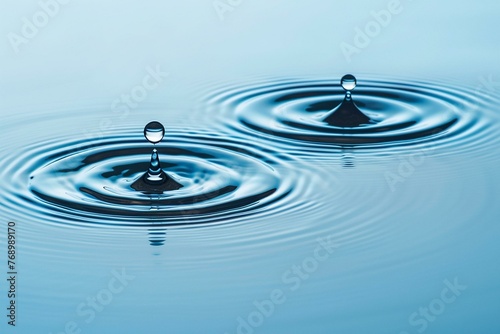 Serene Water Droplets Creating Ripples on Calm Surface