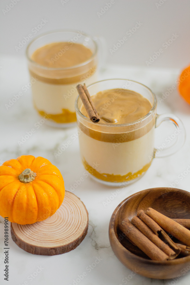 Pumpkin Latte on white background. Autumn concept. Pumpkin Latte on white background. Autumn concept.