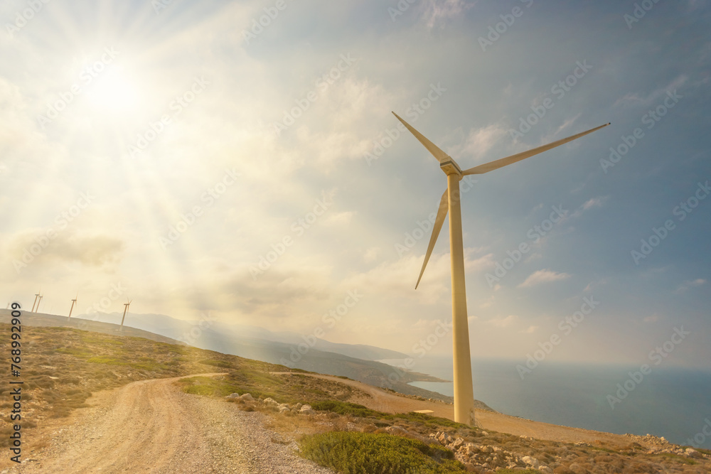 Obraz premium Wind turbines on beautiful sunny mountain landsape. Green power generation concept.