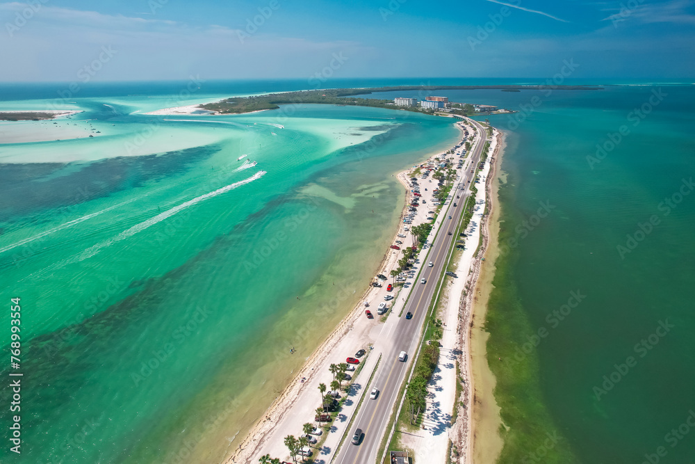 Florida. Beach on Island. Panorama of Honeymoon, Caladesi Island State Park FL. Dunedin Causeway. Summer vacation. Turquoise color of salt water. Ocean, Gulf of Mexico. Tropical Nature. Aerial Aerial Florida. Beach on Island. Panorama of Honeymoon, Caladesi Island State Park FL. Dunedin Causeway. Summer vacation. Turquoise color of salt water. Ocean, Gulf of Mexico. Tropical Nature. Aerial Aerial