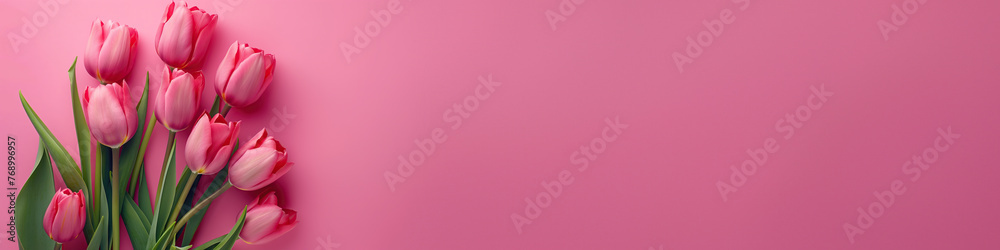Pink tulips on pink background, flat lay banner with copy space