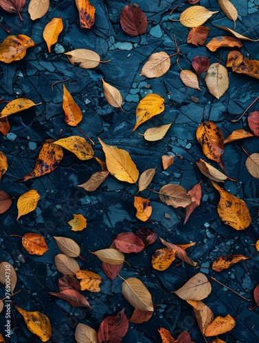 A collection of various leaves scattered and piled on the ground in a natural setting