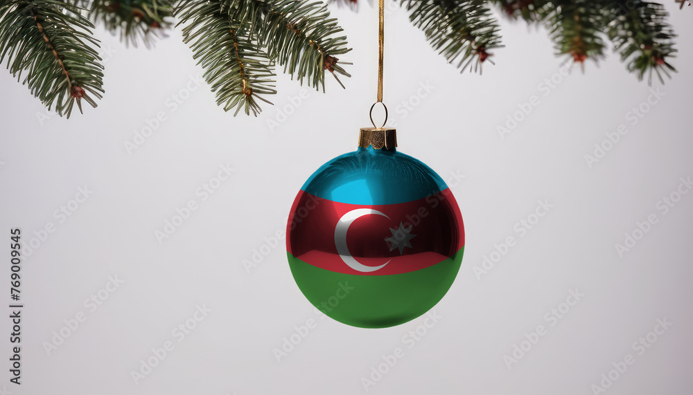 New Year's ball with the flag of Azerbaijan on a Christmas tree branch isolated on white background. Christmas and New Year concept.