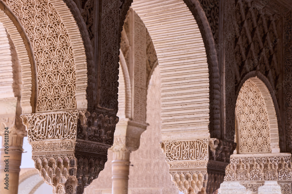 Richly detailed Arabic style wall decorations in the Royal Nazaries Palace in Alhambra, Granada, Andalusia, Spain Richly detailed Arabic style wall decorations in the Royal Nazaries Palace in Alhambra, Granada, Andalusia, Spain