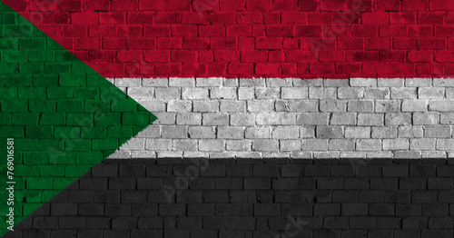 Republic of the Sudan Flag Over a Grunge Brick Background photo