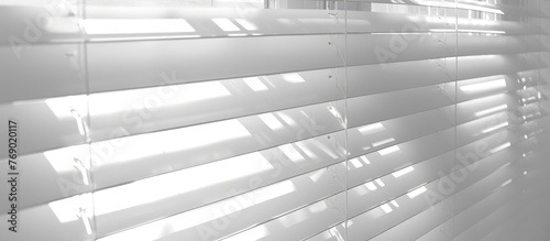 White blinds providing shade from sunlight.