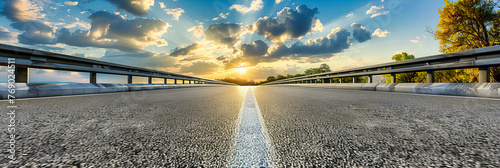 Empty Highway at Sunset, Asphalt Road Stretching into the Horizon under a Vibrant Sky, Travel Background