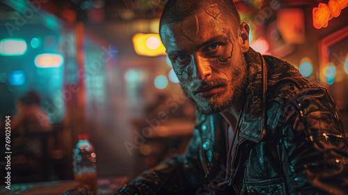 Man with tattoos in a neon-lit setting