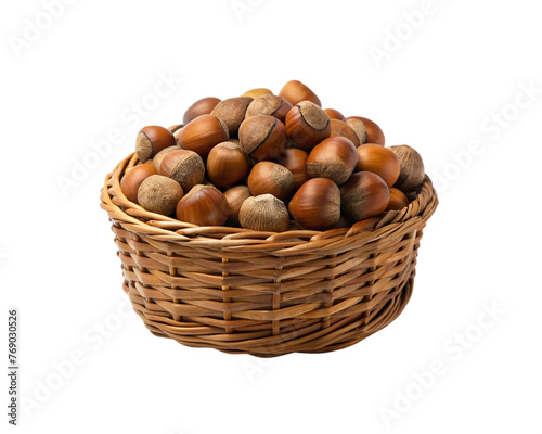 Hazelnuts in a wicker basket isolated on transparent background.
