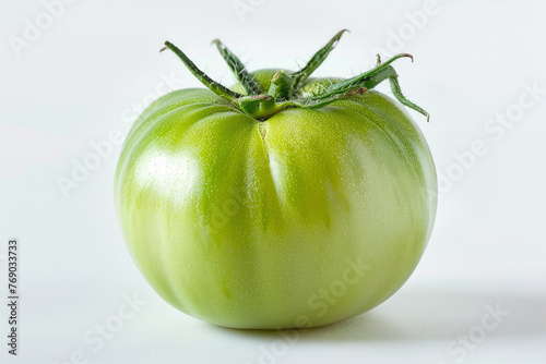green tomato on white background