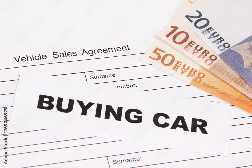 Vehicle sales agreement, inscription buying car and euro banknotes. Sales, buying new or used car Vehicle sales agreement, inscription buying car and euro banknotes. Sales, buying new or used car