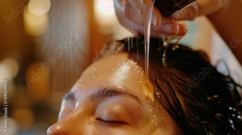 A close-up photo of a guest receiving a pampering scalp treatment, with nourishing oils massaged into the scalp - happiness, bliss, relaxation, love and harmony