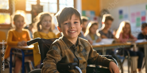 Cheerful preteen boy sitting in a wheelchair in a classroom in school. Disabled child learning new skills with his typical peers. Education for special needs children.