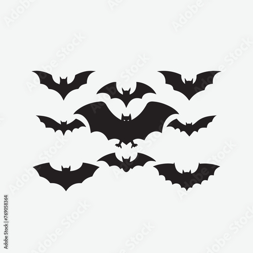 Black silhouettes of bats set on a white background vector art illustration