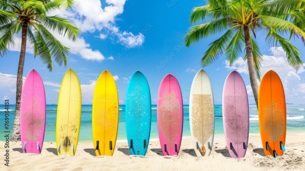 Colorful surfboards ready for the waves on sunny beach next to sea with waves   surf s up
