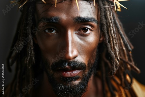 A man with dreadlocks and a cross on his head