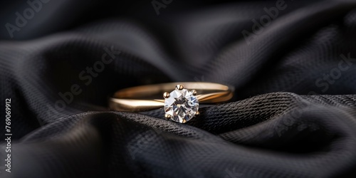 Elegant Gold Diamond Ring on Textured Backdrop