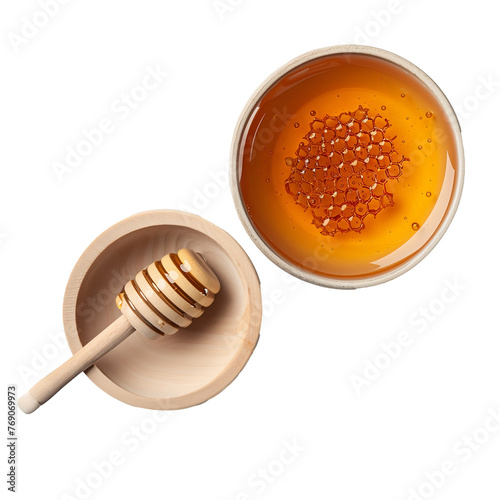 A wooden bowl with honey and a wooden spoon © Mustafa