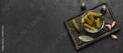 Obraz na plátně Composition with tasty pickled cucumbers on dark background with space for text,