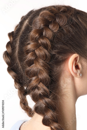 Woman with braided hair on light background, closeup