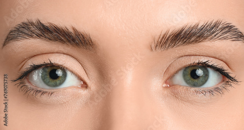Young woman with green eyes...