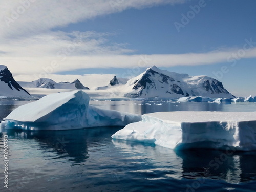 Antarctic landscape with glaciers and snow-covered ice floes at sea. Antarctica. The polar pole.