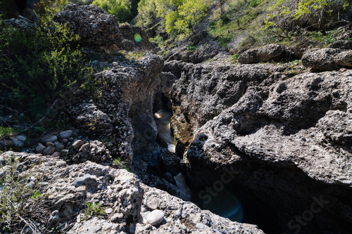 Aksu Canyon with a river in the mountains in Kazakhstan photo