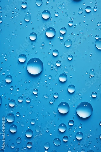 water droplets on all blue matte background with copy space and blank pattern for text or photo backgrdrop