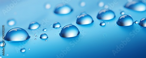 water droplets on all blue matte background with copy space and blank pattern for text or photo backgrdrop