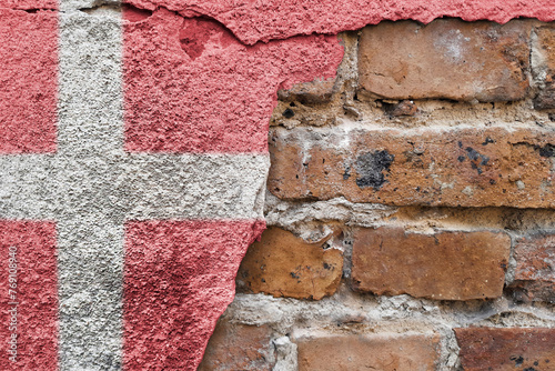 Denmark. Danish flag on stone wall. Copy space. Constitution day and Independence Day. photo