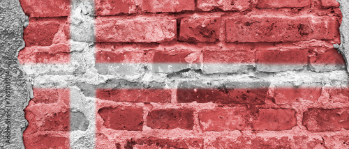 Banner with flag of Denmark. Danish national symbol on brick wall. photo