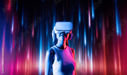 Φωτογραφία Smart female standing surrounded by neon light wearing VR headset connecting metaverse, future cyberspace community technology