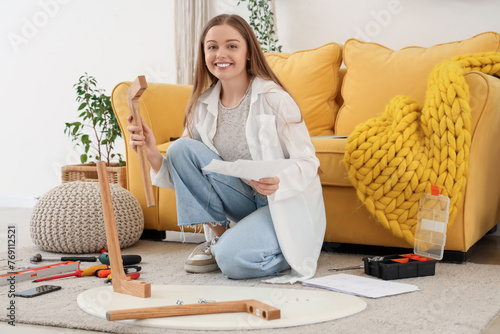 Smiling young woman assembl...