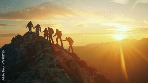 Panoramic view of team of people holding hands and helping each other reach the mountain top in spectacular mountain sunset landscape © Александер Подсадник