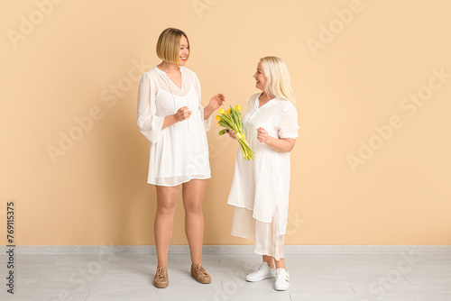 Adult woman greeting her mo...