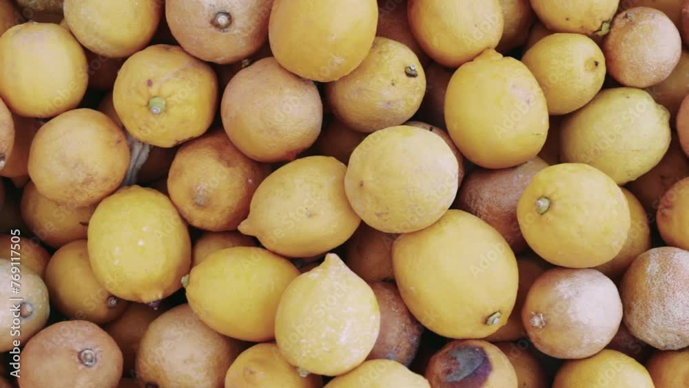 Lemon, garbage pile shows consumption flaws. Lemon, garbage accumulation critiques overproduction. Lemon, garbage issue, calls for consumer awareness Lemon, garbage pile shows consumption flaws. Lemon, garbage accumulation critiques overproduction. Lemon, garbage issue, calls for consumer awareness