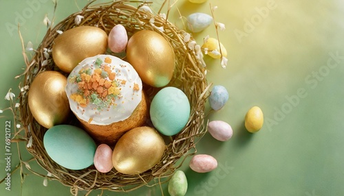 small easter cakes and colorful pastel easter eggs in nest on green background top view happy easter poster and banner for greeting card