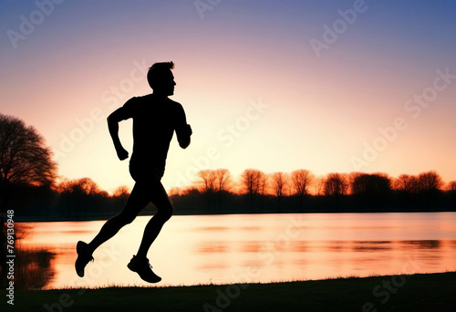 Silhouette of man running on the beach at sunset. Healthy lifestyle concept, poster, banner, copy space.
