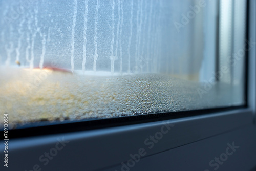 Tableau sur toile Indoor close-up of a leaky window. Condensate water on window